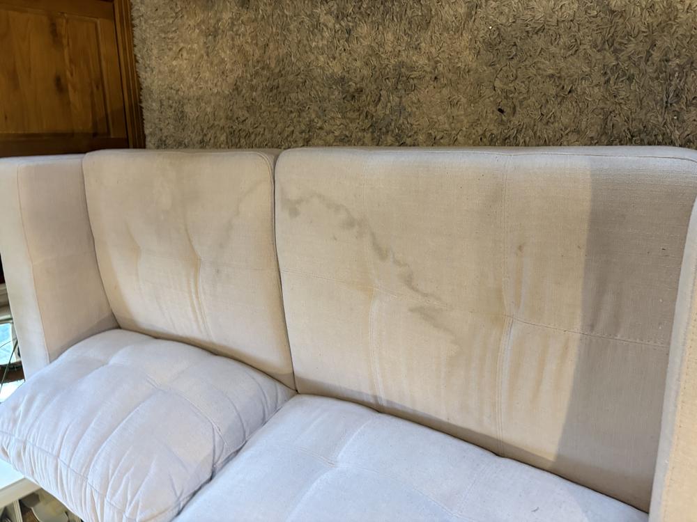Before photo of the lounge suite in Ocean Reef.